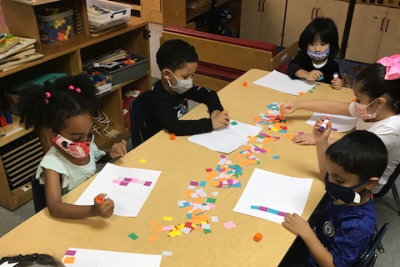 boy showing his artwork