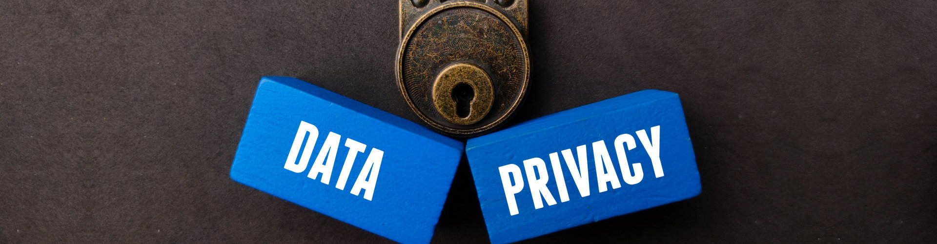 A vintage padlock and blue wooden cubes with the words DATA and PRIVACY