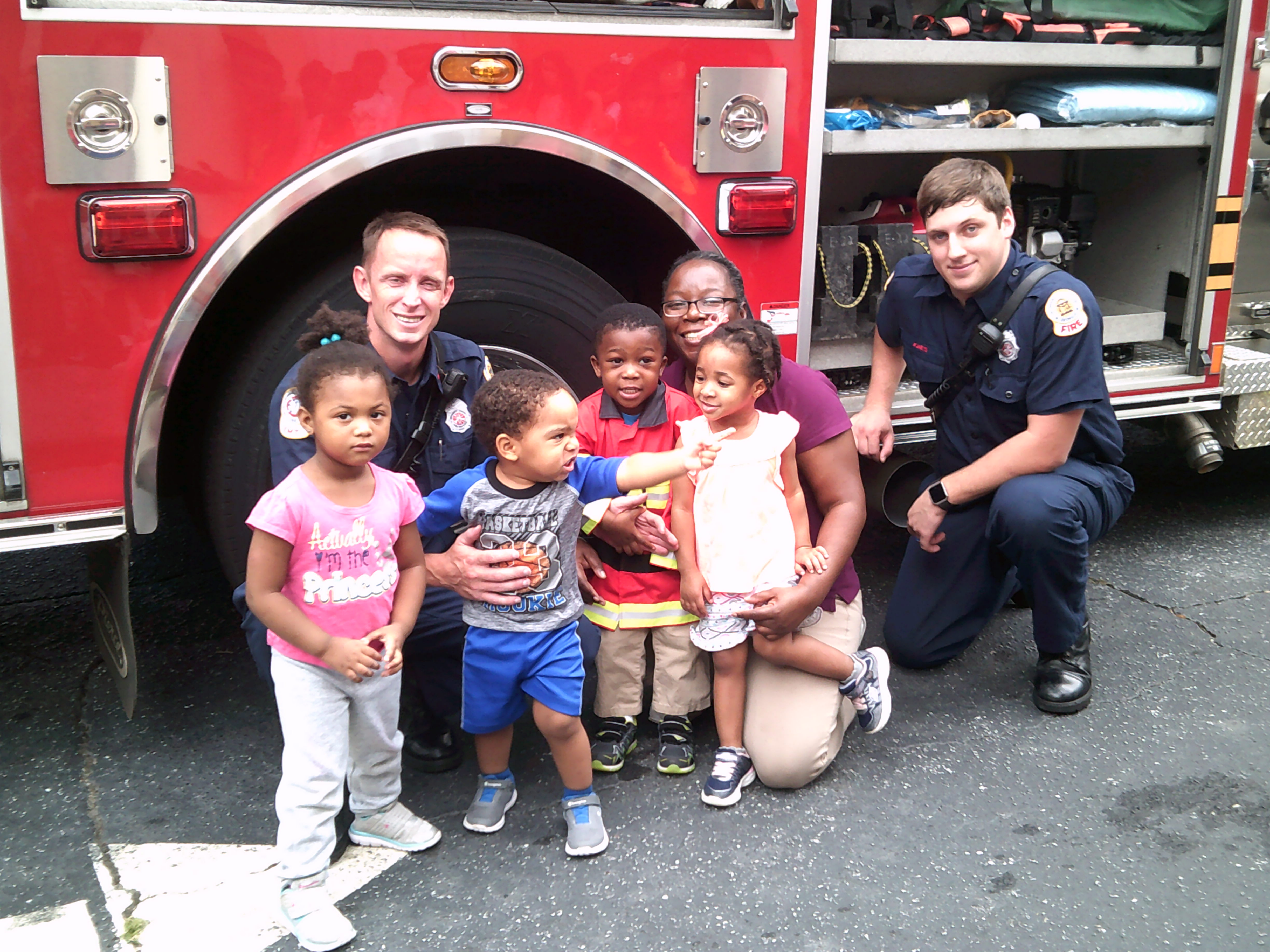 fire officers with kids