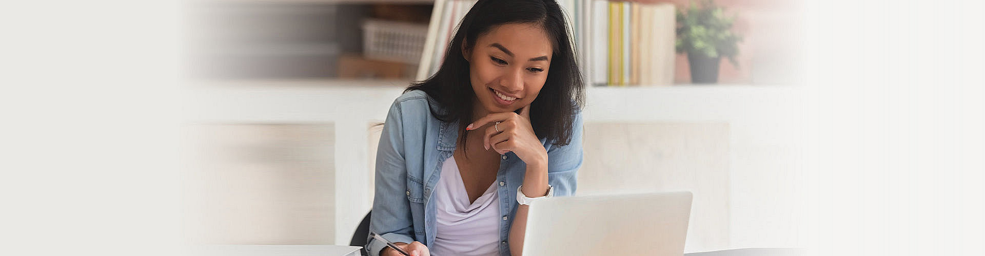 woman staring at her laptop